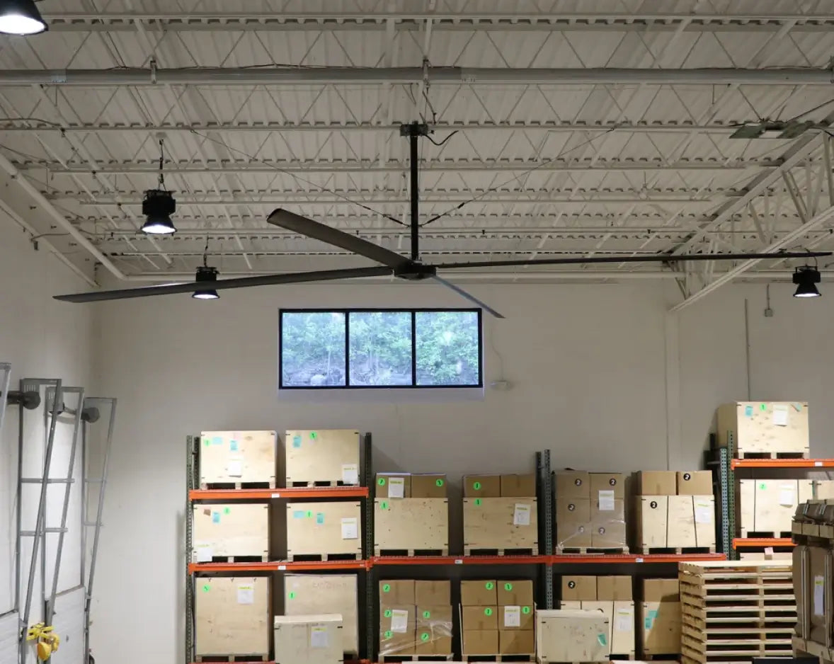 Hunter Industrial ECO HVLS fan above warehouse racking with palletized inventory