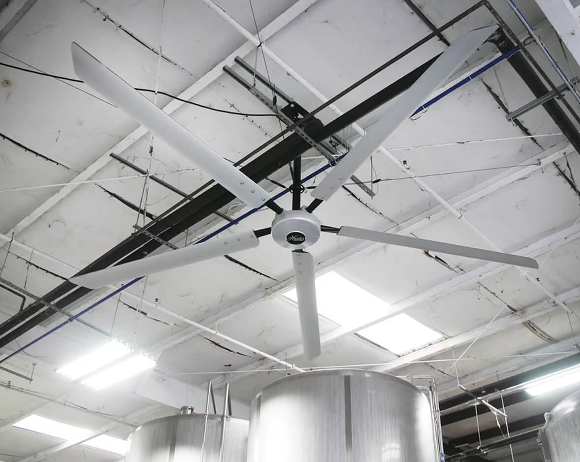 Hunter Industrial Titan HVLS fan installed above stainless steel processing tanks in food and beverage facility